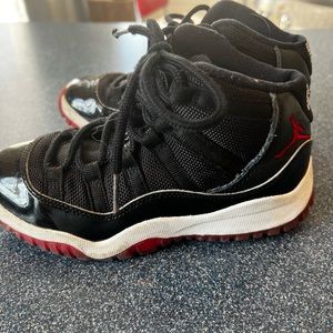 Nike Air Jordan Retro XI Bred (red and black kids Jordan 11’s)